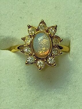 Avon Gold Tone Opal Cabochon Sunburst Ring with Clear Stones